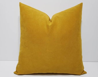 mustard and grey pillows