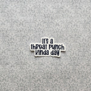 May include: White sticker with black text that reads "It's a throat punch kinda day".