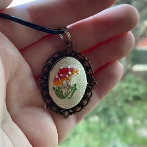 Hand embroidered mushroom pendant