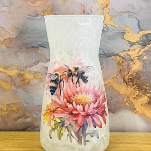 Beautiful handmade vase with a pink floral bee design finished in a glitter varnish