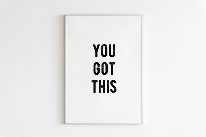 May include: A white framed print with the text "YOU GOT THIS" in black lettering.