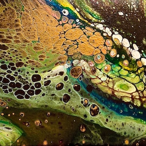 May include: Abstract painting featuring a swirling pattern in gold, green, black and white paint. The paint creates a variety of shapes and textures, including circles, swirls and lines.