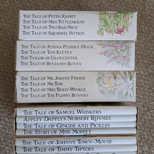 May include: A stack of eight white books with colourful illustrations on the covers. The books are all titled "The Tale of..." and feature characters from Beatrix Potter's children's stories. The titles include "The Tale of Peter Rabbit", "The Tale of Mrs. Tittlemouse", "The Tale of Two Bad Mice", "The Tale of Squirrel Nutkin", "The Tale of Jemima Puddle-Duck", "The Tale of Tom Kitten", "The Tailor of Gloucester", "The Tale of Benjamin Bunny", "The Tale of Mr. Jeremy Fisher", "The Tale of Mr. Tod", "The Tale of Mrs. Tiggy-Winkle", "The Tale of the Flopsy Bunnies", "The Tale of Samuel Whiskers", "Appley Dapply's Nursery Rhymes", "The Tale of Ginger and Pickles", "The Story of Miss Moppet", "The Tale of Johnny Town-Mouse", "The Tale of Timmy Tiptoes", "The Tale of the Pie and the Patty Pan", and "Cecily Parsley's Nursery Rhymes".