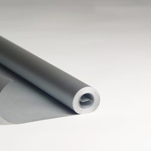 May include: A roll of silver wrapping paper is partially unrolled, showing the metallic sheen of the paper.