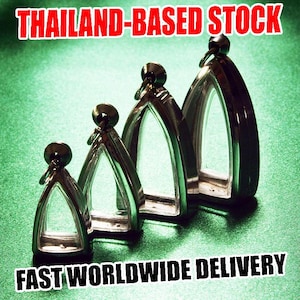 May include: Four silver arched pendants of different sizes are displayed on a green surface. Each pendant has a clear centre and a small, round top. The text "THAILAND-BASED STOCK" and "FAST WORLDWIDE DELIVERY" are displayed.