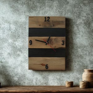 May include: A rectangular wooden wall clock with a natural wood grain finish and black horizontal stripes. The clock has black numerals and hands, with a red second hand. The clock is mounted on a gray wall.
