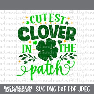 May include: Green and gold graphic design with the text "Cutest Clover in the Patch".