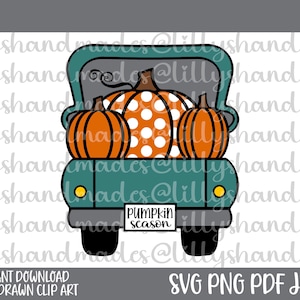 May include: A teal blue pickup truck with a white polka dot pumpkin and two orange pumpkins in the bed. The truck has a license plate that says "pumpkin season".