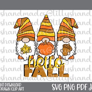 May include: A digital graphic featuring three fall gnomes with striped hats in orange and brown. Each gnome holds a fall symbol: a leaf, a pumpkin, and an acorn. The words "hello FALL" are in the center. The image is labeled "Instant Download Hand Drawn Clip Art".