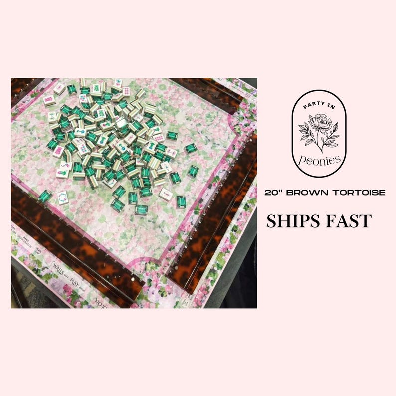 May include: A 20-inch brown tortoise mahjong set with a floral patterned playing surface. The set includes green and white tiles scattered across the board. The image also includes the text "Party in Peonies".