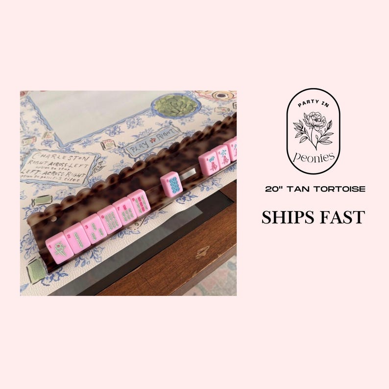 May include: A tan tortoise mahjong tile rack with pink tiles. The tiles are arranged on a decorative tray with a scalloped edge. The background features a floral pattern and the text "Party in Peonies".