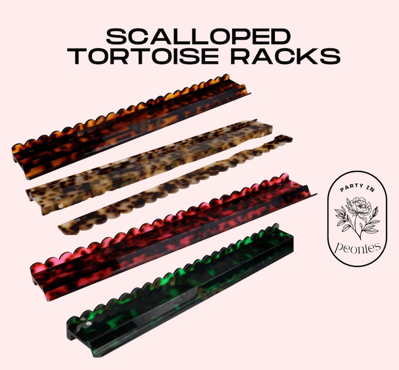 May include: Scalloped tortoise racks in various colors: brown, tan, red, and green. The racks have a scalloped edge and are arranged on a light pink background. The text "SCALLOPED TORTOISE RACKS" is at the top.
