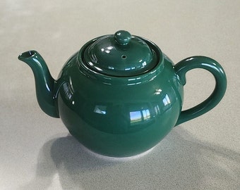 Vintage Teapot Dark Green with Seperate Strainer, Holds 5 1/2 cups. Made in Japan for Williaks Sojoka. 5 inches tall, 9 1/4 inches long.