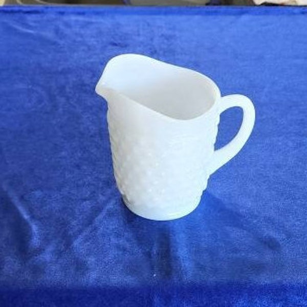 Vintage Milk Glass Hobnail Small Pitcher by Anchor Hocking. Holds 16 ounces and is 5 1/4 inches tall.