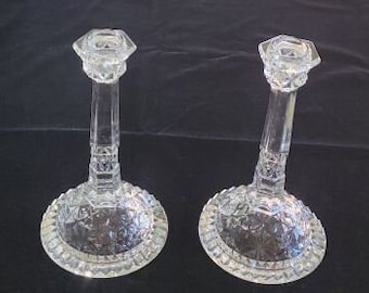 Vintage Pair of Candlesticks with Nice Sparkle, unknown pattern.  8 1/2 inches tall with a sturdy 4 3/4 inch diameter base. Great Condition.