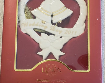 Vintage LENOX Christmas Ornament, Wedding Day 2011, features a heart with flowers and bells. It is in the original box.