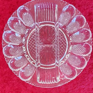 Vintage L.E. Smith Egg and Relish Plate that holds 12 Deviled Eggs and has Divided Areas for Relishes, 10 3/4 inches in diameter. No damage.