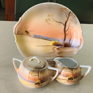 Vintage Meito China Hand Painted Open Handled Plate with matching Cream and Sugar with Lid. Made in Japan.  No chips or cracks.