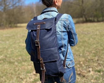 Waxed canvas rucksack handcrafted to last decades. Waterproof retro heritage bag for men and women.