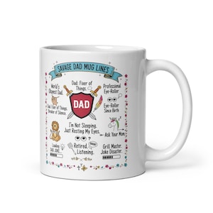 May include: White ceramic mug with the text "SAVAGE DAD MUG LINES" and various phrases like "World's Okayest Dad" and "Dad: Fixer of Things." The mug features a decorative floral border and a handle on the right side.