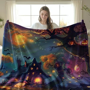Halloween blanket design featuring a magical haunted house surrounded by glowing pumpkins, twinkling lights, bats, and colorful autumn trees, with a small witch standing under a vibrant night sky.