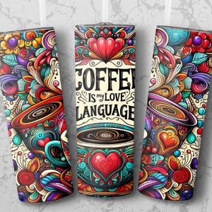 May include: A colourful, illustrated tumbler with a coffee cup design. The tumbler features a whimsical design with hearts, swirls, and the text "Coffee is my love language".