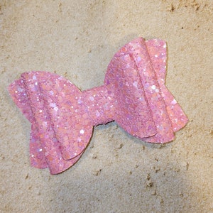 Super sparkly non-shed perfect pink glitter girls' hair bow. Available in multiple sizes and styles.