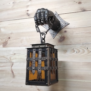 Wrought iron wall lamp on a metal knight&#39;s hand. Wall lantern, Ceiling lantern, Wrought iron sconces, lantern centerpiece, Medieval lantern