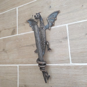 Dragon door handle in antique, medieval style