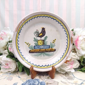 19th century plate with bird on a pedestal