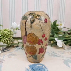 Small enameled metal vase