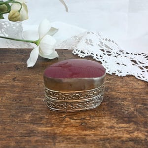 Silver and red stone pillbox