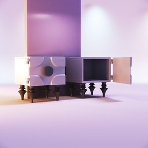 Peut inclure: Deux tables de chevet modernes de couleur claire avec un design géométrique. L'une des tables a une porte ouverte, révélant un intérieur vide. Les tables ont des pieds sombres et ornés et un accent circulaire. Le fond présente un mur violet.