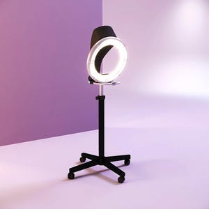 May include: A black and silver ring light on a black stand with wheels. The ring light is illuminated, and the background is a gradient of purple and white.
