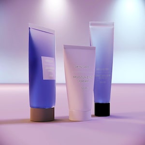 May include: Three skincare product tubes. The tubes are labeled "Skin Care" and "Moisturizing Cream", with a 50 ml volume. The tubes are in shades of purple and white, with a light purple background.