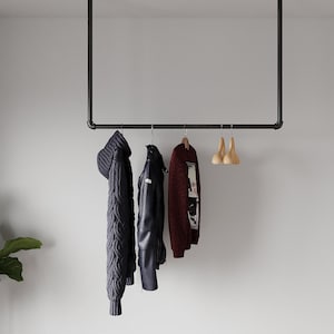 Minimalistic Clothes Rack | Garment Rail made of metal mounted on the ceiling Ceiling Clothing rack