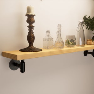 Reclaimed shelf with pipe Brackets handcrafted from solid timber 3.3cm thickness and 22.5cm depth.