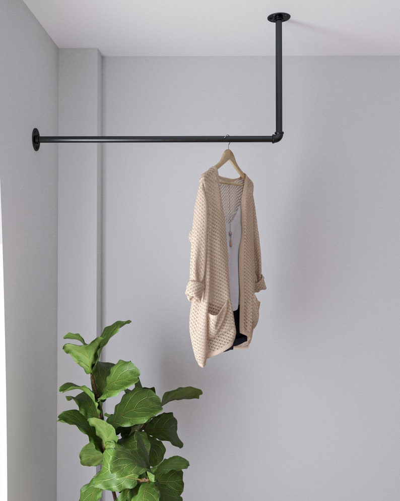 A durable and versatile Industrial Pipe Wall-Mounted Clothing Rack, crafted from high-quality malleable iron, perfect for keeping garments and accessories organized and tidy in any space,