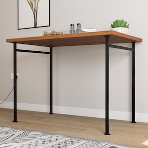 May include: A rectangular wooden desk with a dark brown surface and black metal legs. The desk is approximately 40 inches long and 20 inches wide. A small succulent plant in a white pot and decorative items sit on top of the desk.