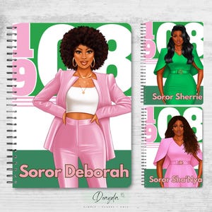 May include: Two pink and green spiral notebooks with images of women wearing pink and green outfits. The notebooks have the text "Soror Deborah" and "Soror Sha'Nya" on them.