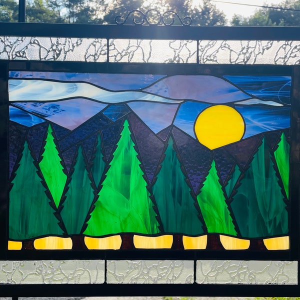 Mountains and trees stained glass.