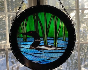 loon in water stained glass panel