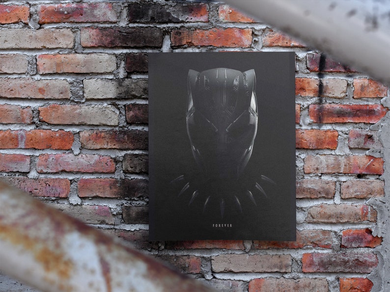 May include: Black and white poster featuring a close-up of Black Panther's mask with the word "FOREVER" at the bottom.