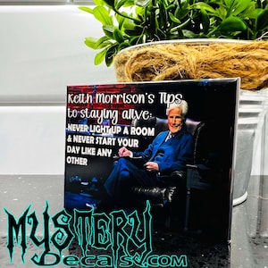 May include: A black and white image of a man sitting in a chair. The text on the image reads "Keith Morrison's Tips to staying alive: NEVER LIGHT UP A ROOM & NEVER START YOUR DAY LIKE ANY OTHER".