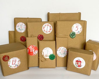 May include: A selection of brown paper-wrapped parcels, possibly for an advent calendar. Each is decorated with a numbered sticker and sealed with a wax seal. The stickers display festive illustrations and numbers from 1 to 24.