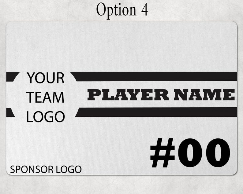 May include: A rectangular white sign featuring black text and graphics. The design includes the text YOUR TEAM LOGO, PLAYER NAME, and SPONSOR LOGO, along with the number #00. Two horizontal black stripes frame the player name area.