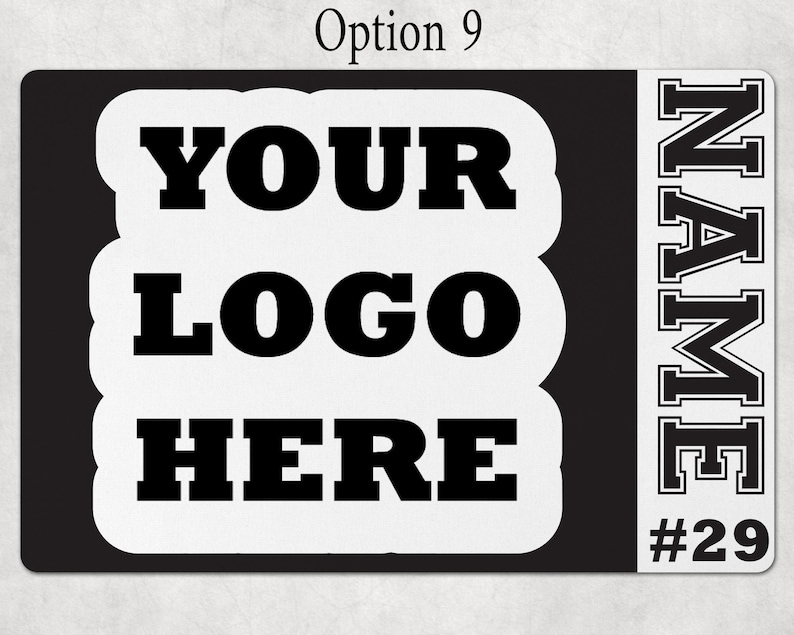 May include: A rectangular black and white sign featuring the text YOUR LOGO HERE in a bold black font on a white background, with a vertical white sidebar on the right containing the word NAME in a block font and the number #29 below it.