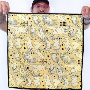 May include: A square yellow bandana featuring a repeating black line art pattern of bearded figures in various poses, interspersed with small black hearts and the text "BIG BOYS" printed in a bold, sans-serif font throughout the design.