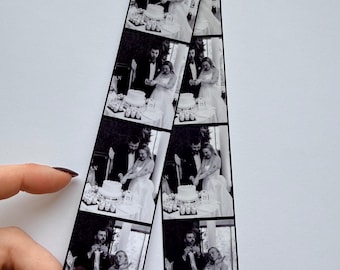 May include: A black and white photo strip featuring four vertical frames of a couple in formal wedding attire cutting a tiered cake together. The images capture the sequence of the cake cutting process, showing the pair interacting with the dessert.