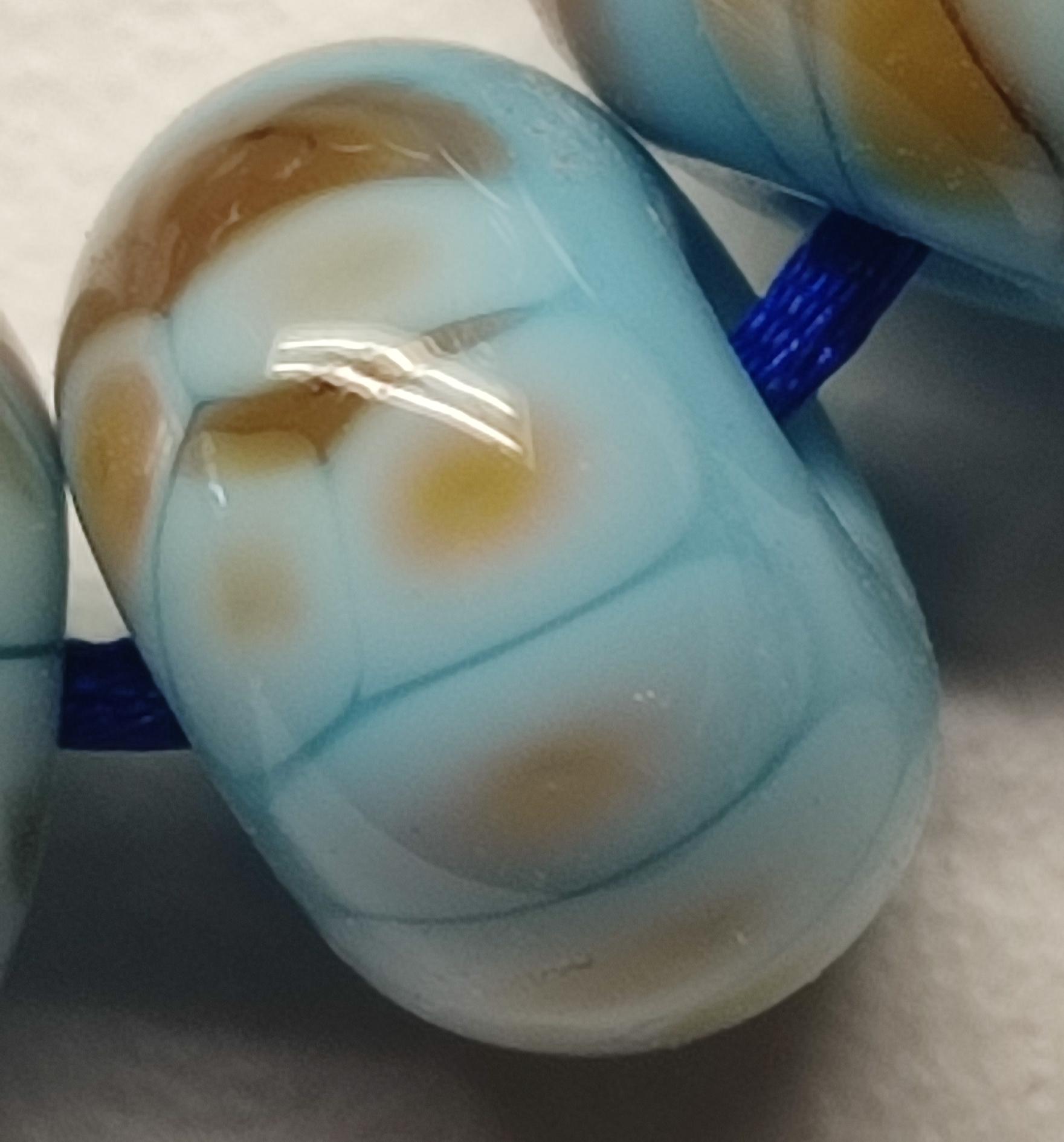 9 handgemaakte glaskralen in verschillende vormen, sky blue met decoratie van kleine glasstukjes by Petra Hergarden, unieke set